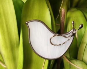Dove plant stake of minimalist design, in wispy white art glass with twisted wire wing detail, on a brass rod placed in a potted plant